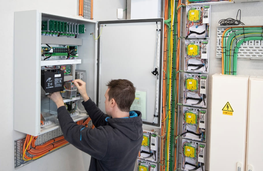 Technician wiring electrical box